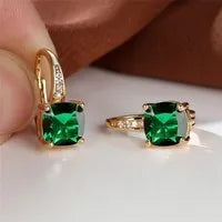 Square geometric ear hook earrings with zircon stones in an electroplated copper setting.