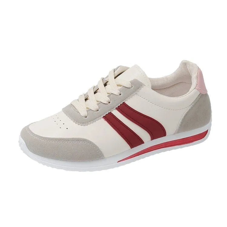 A pair of blue low-top lace-up running sneakers with a round toe and soft rubber sole on a white background.