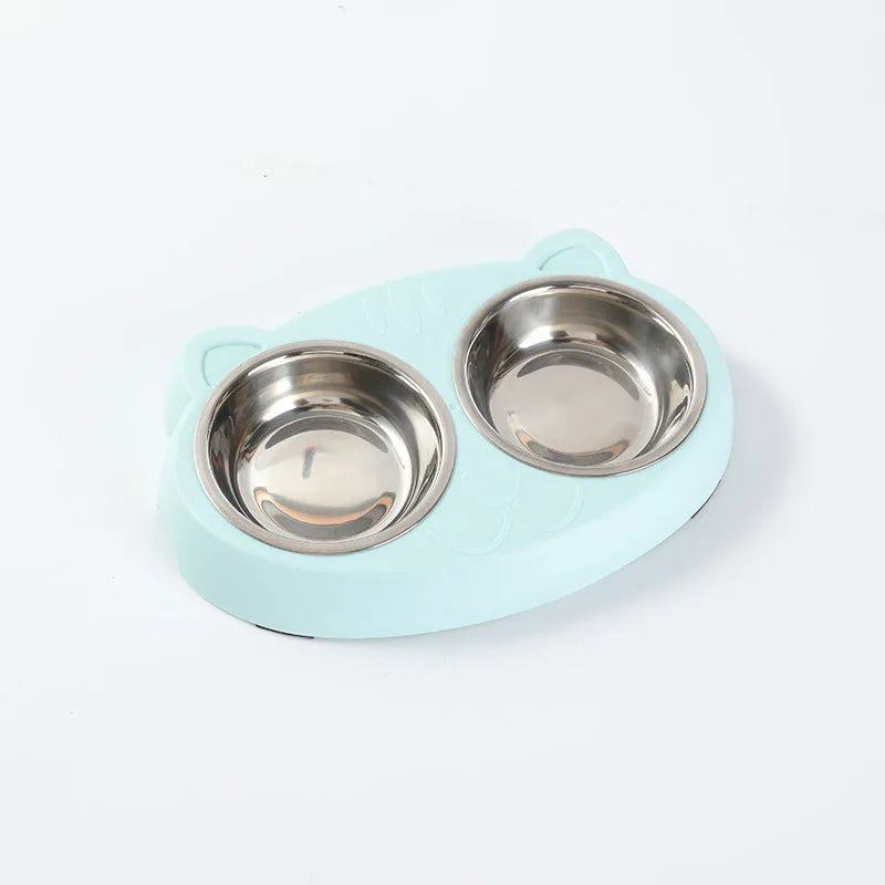 Blue macaron-shaped plastic pet feeding tray with two bowls for cats and small dogs on a white surface