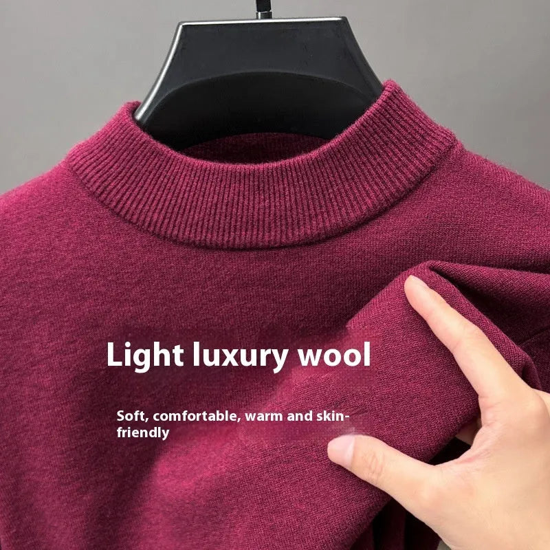 Men's solid colour fine yarn half-turtleneck long sleeve pullover on a hanger.