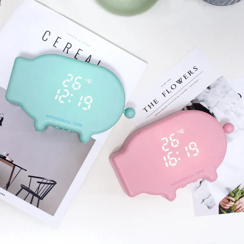 Multifunctional LED alarm clock with temperature display available in blue or pink with USB cable