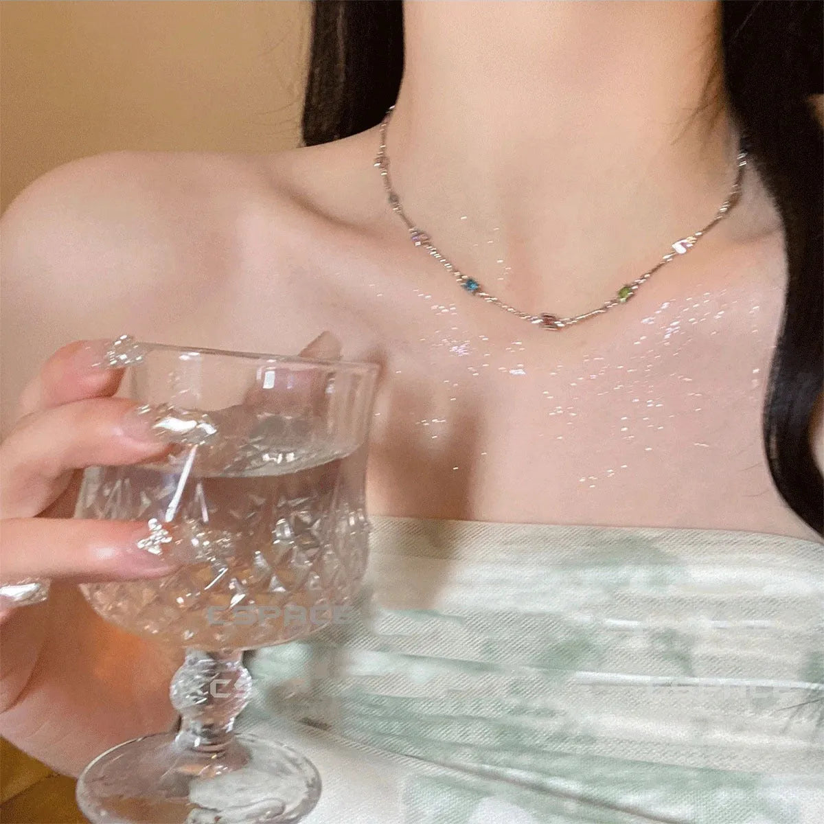 Fine gold-tone geometric necklace with a square clear crystal pendant on a clavicle-length chain.