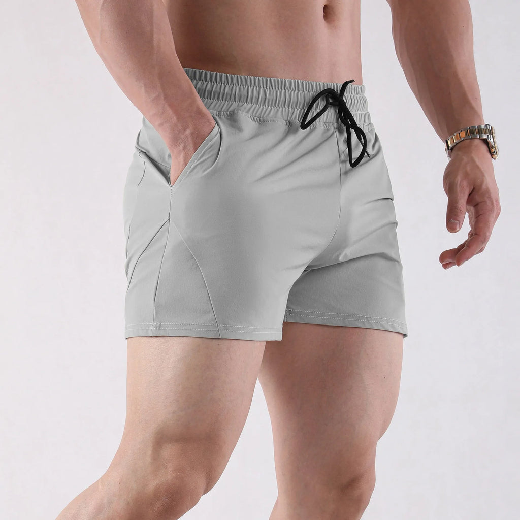 Men's thin grey polyester basketball shorts with an elastic waistband for summer sports.