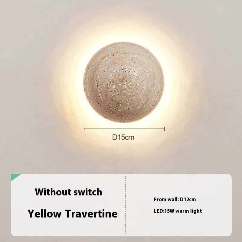 Vintage semicircle wall lamp with yellow cave stone shade and black iron frame mounted on a wall.