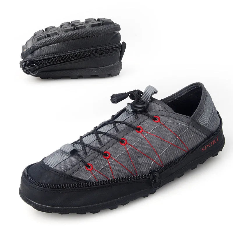 Orange portable folding outdoor hiking shoe with side zipper on a grey background.
