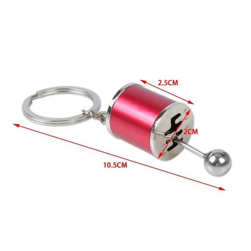 Polished metal gear shift keychain in black showing 6-speed and reverse gear positions