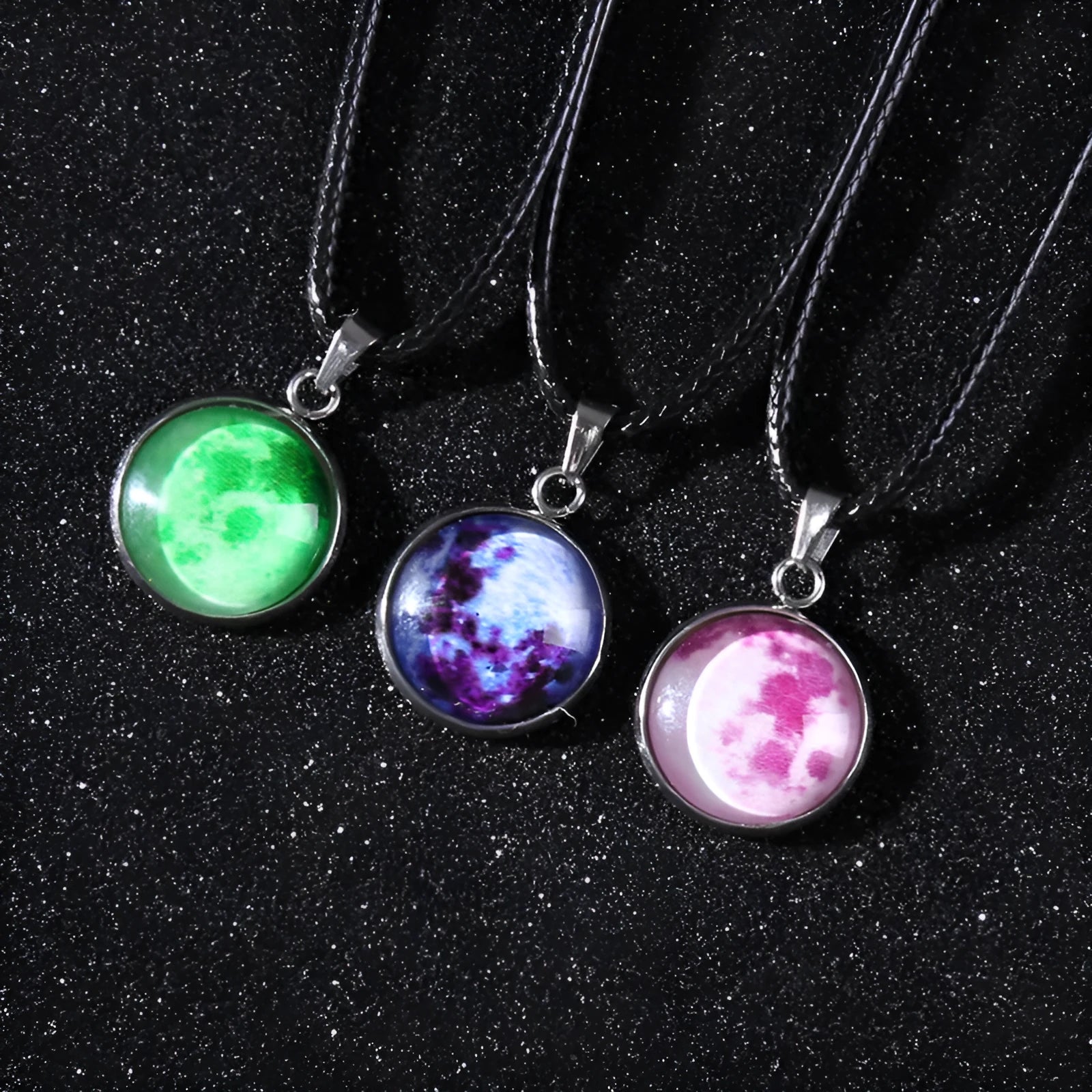 Luminous alloy and organic glass constellation pendant necklace with adjustable chain on white background.