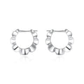 A pair of sterling silver geometric round stud earrings with a retro design and electroplated finish.