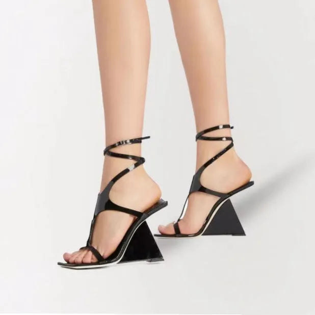 Women's black heeled sandals with a square toe and 9.5cm high heel on a white background.