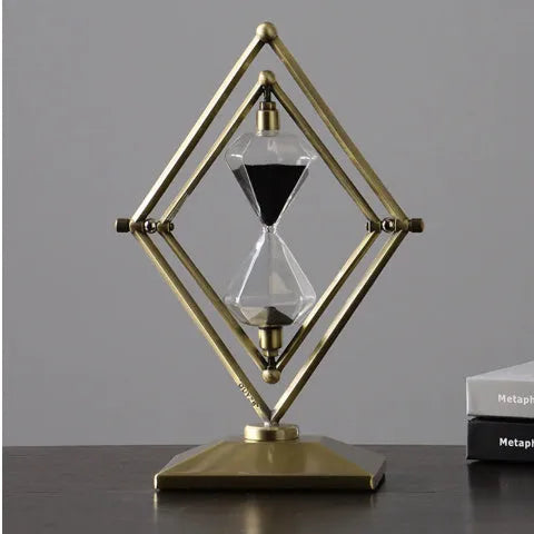 Metal-framed glass hourglass sand timer in bronze or silver with white or black sand