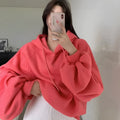 Watermelon red women's sleeveless Mulberry Silk hoodie on a hanger.