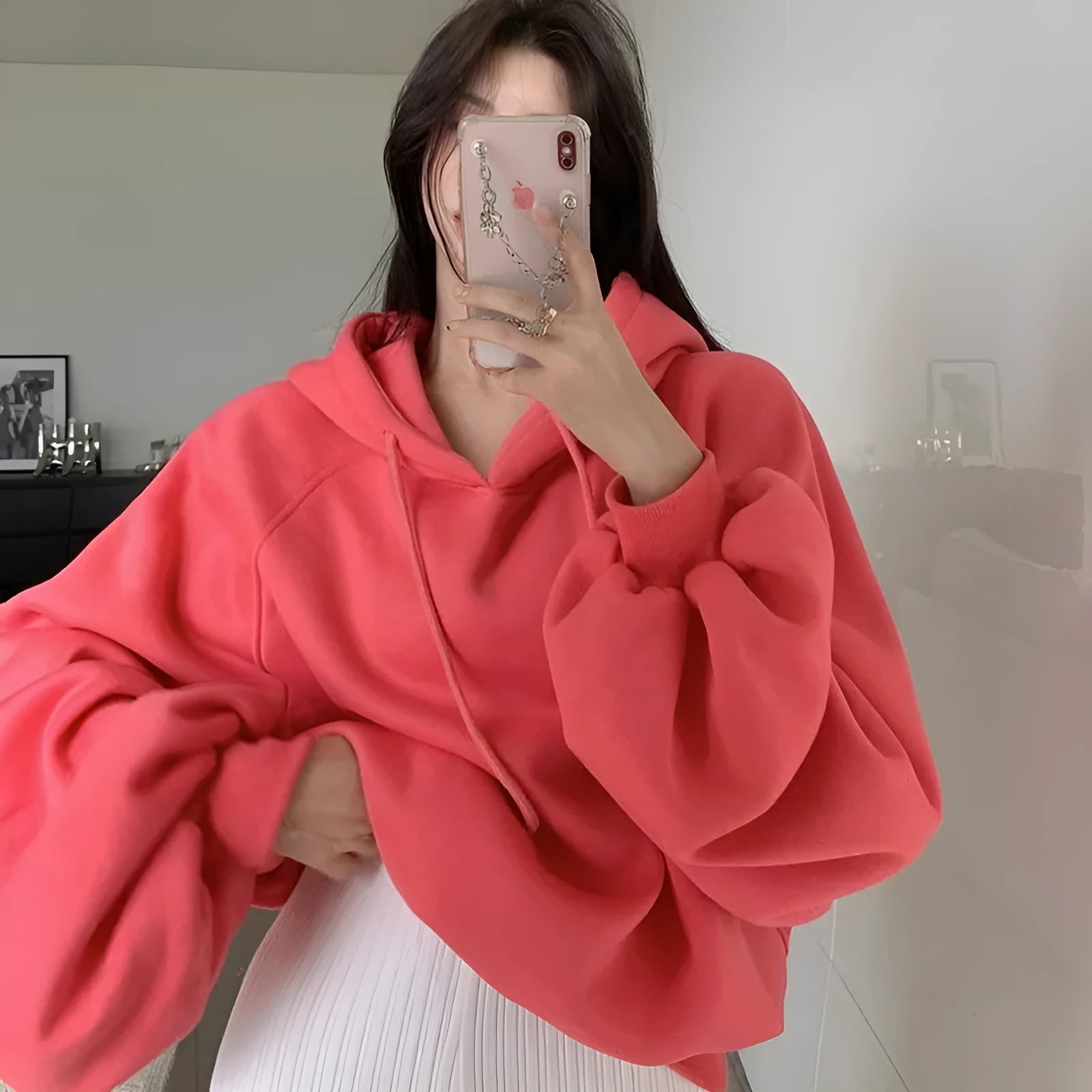 Watermelon red women's sleeveless Mulberry Silk hoodie on a hanger.