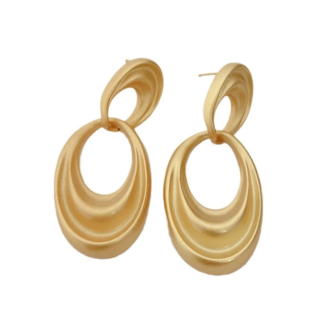 Copper double circle earrings in quicksand colour with a U-shaped French retro silhouette.