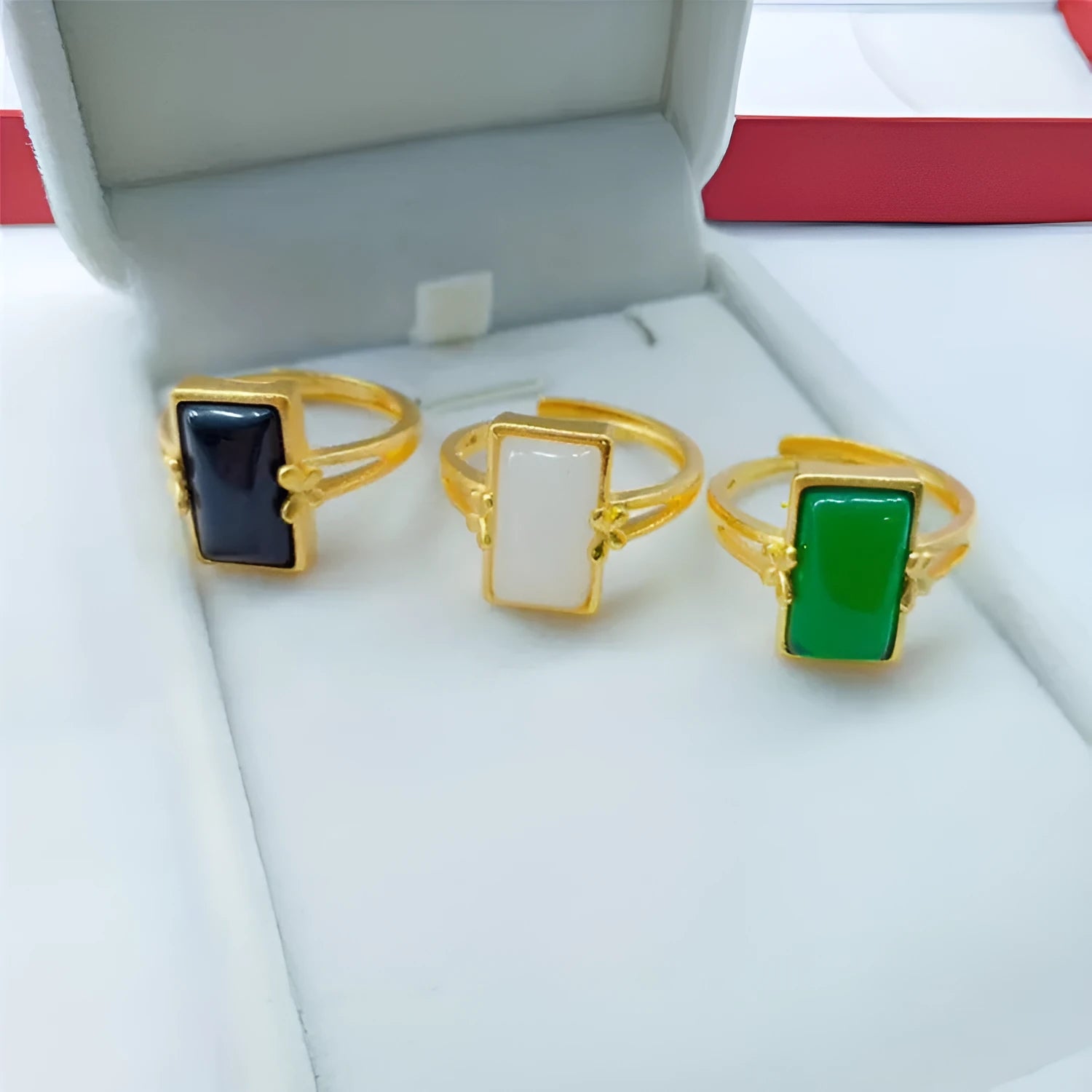 Adjustable brass gold-plated ring with artificial gemstones in black, green and white colour options