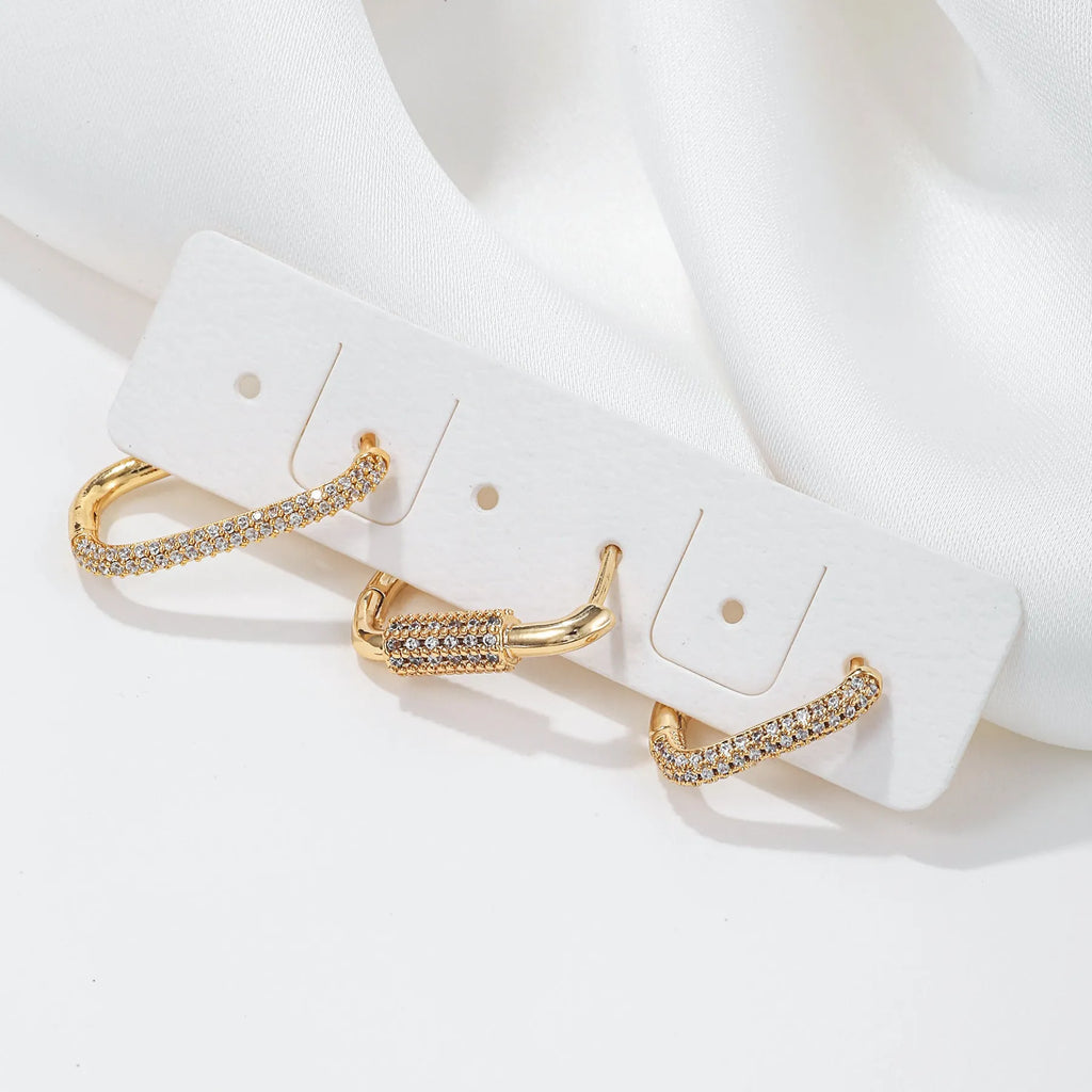Three geometric square ear clips with micro inlaid zircon detailing in gold and white gold colours