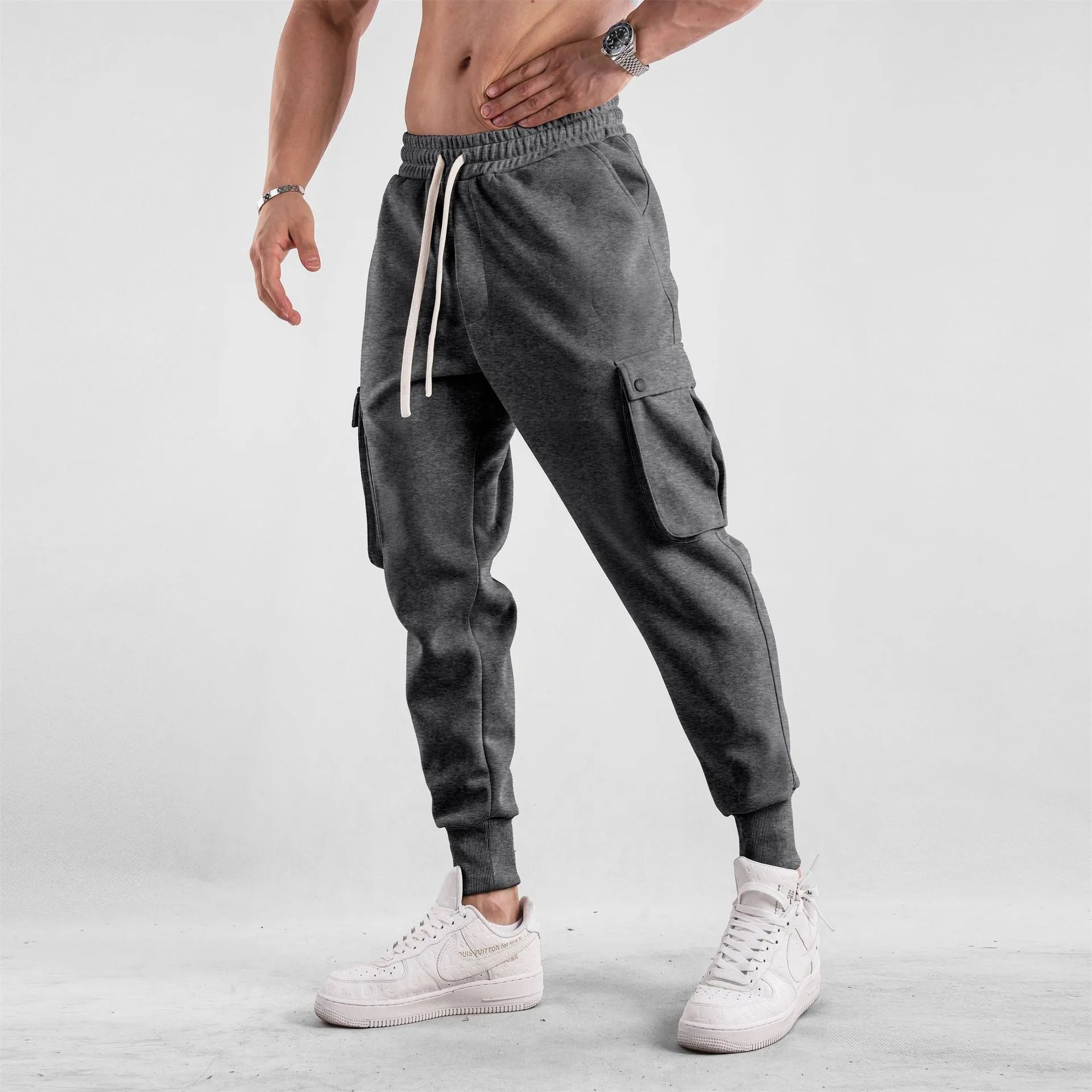 Men's loose cotton trousers with ankle tie fastening and multiple pockets in six colour options