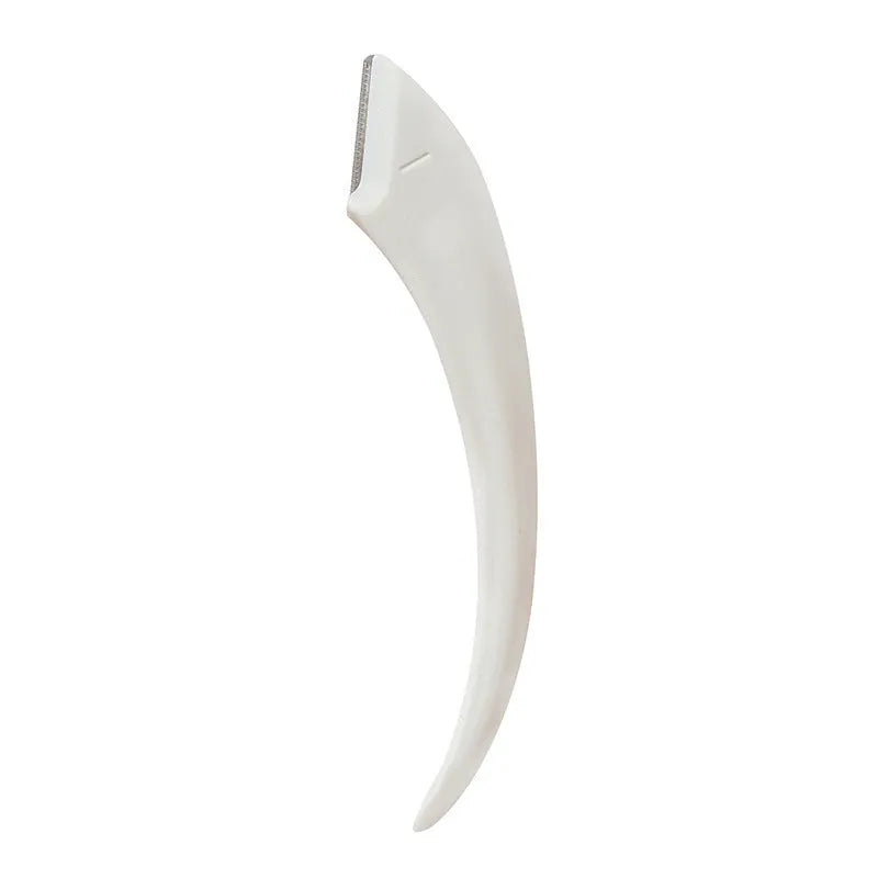 Close-up of a white and pink eyebrow trimming knife with a small comb attached on a plain background.