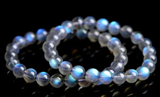 Natural cream blue moonlight crystal bracelet with polished surfaces and simple unisex design