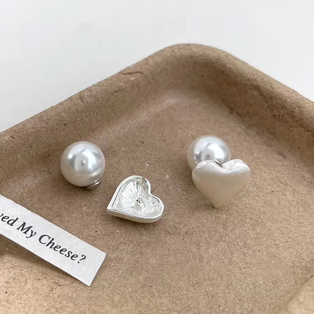 Love Pearl women's white pearl stud earrings with post-back fastening on white background