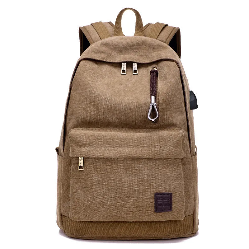 Canvas backpack with USB charging port showing multiple compartments including laptop section