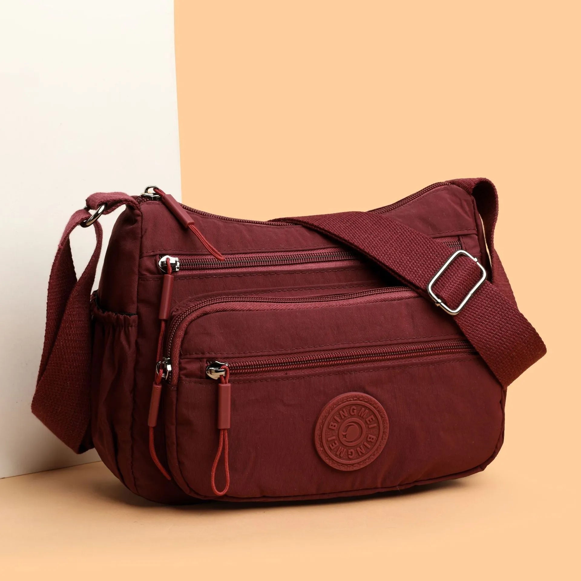 Trendy water-repellent nylon crossbody cloth bag in black with single shoulder strap and outer pocket