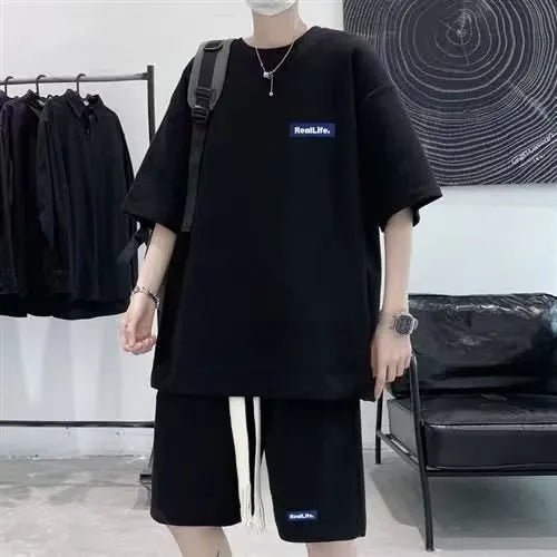 Waffle leisure sports suit consisting of short sleeve top and matching shorts in polyester cotton fabric