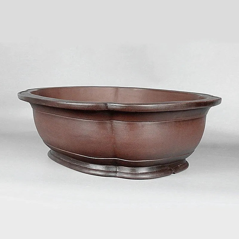 Handmade large purple clay crabapple-shaped flower pot measuring 74cm by 61cm.