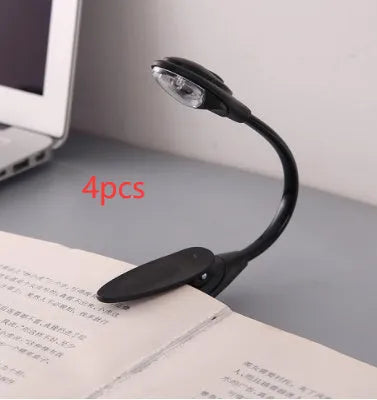 Mini clip-on LED book light in black with 26cm flexible neck and metal clip for attaching to a book