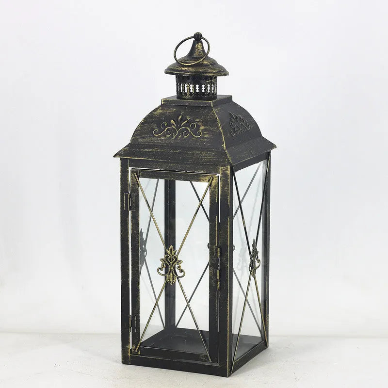 European black and white wrought iron floor-standing storm lantern with tempered glass in three sizes for courtyard decoration.