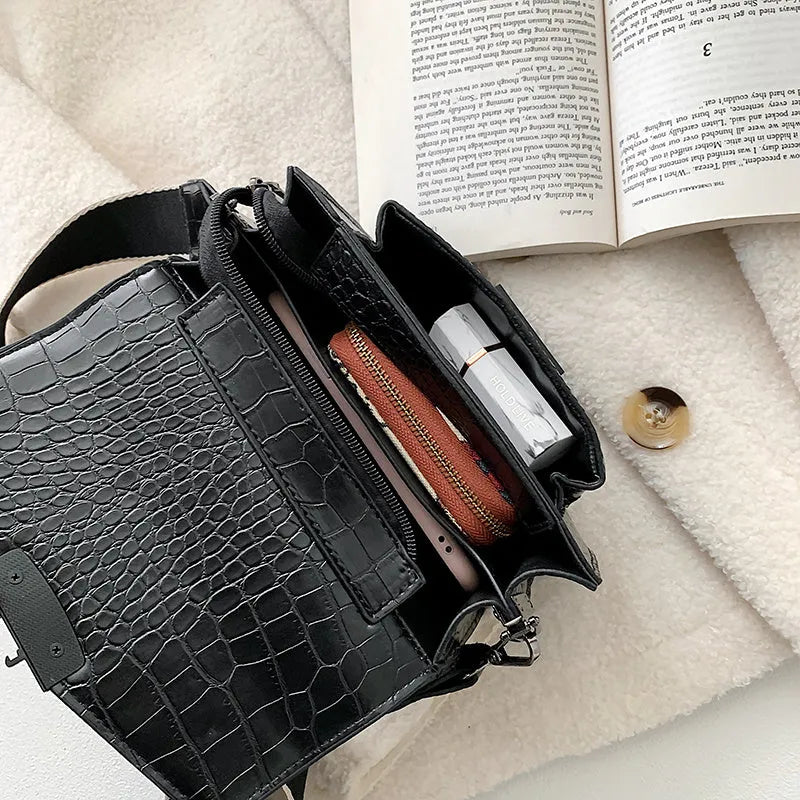 Vintage style crossbody bag in PU leather, shown in black, dimensions 20cm by 14cm.