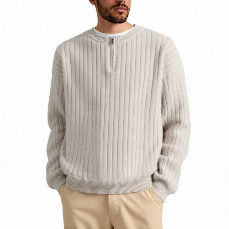 Men's grey loose fit half-zip pullover sweater with textured knit and long sleeves.