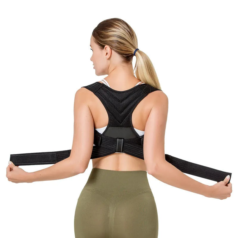 Black posture correction belt with open shoulder design shown on model