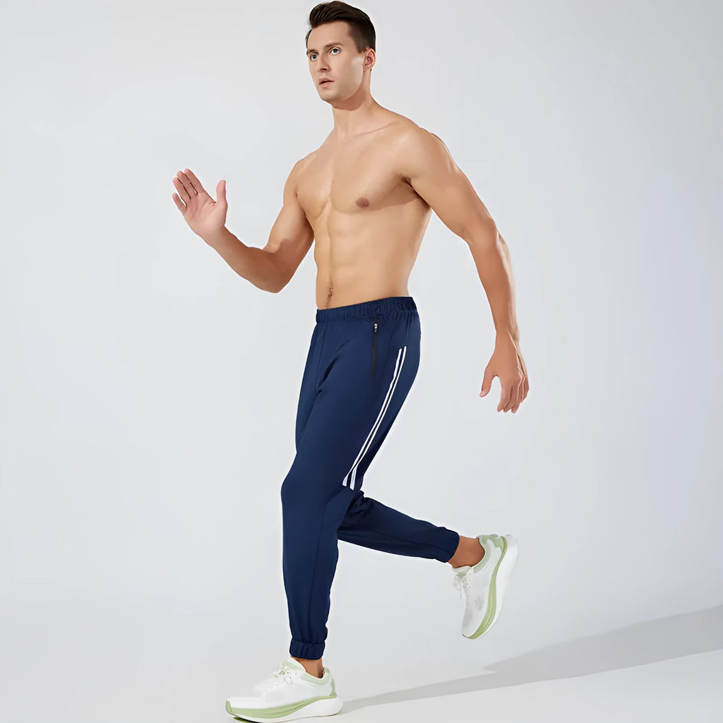 Men's black running trousers with mid waist and full length polyester construction for exercise