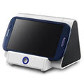 Compact black or white wireless Bluetooth speaker with a built-in microphone for calls.