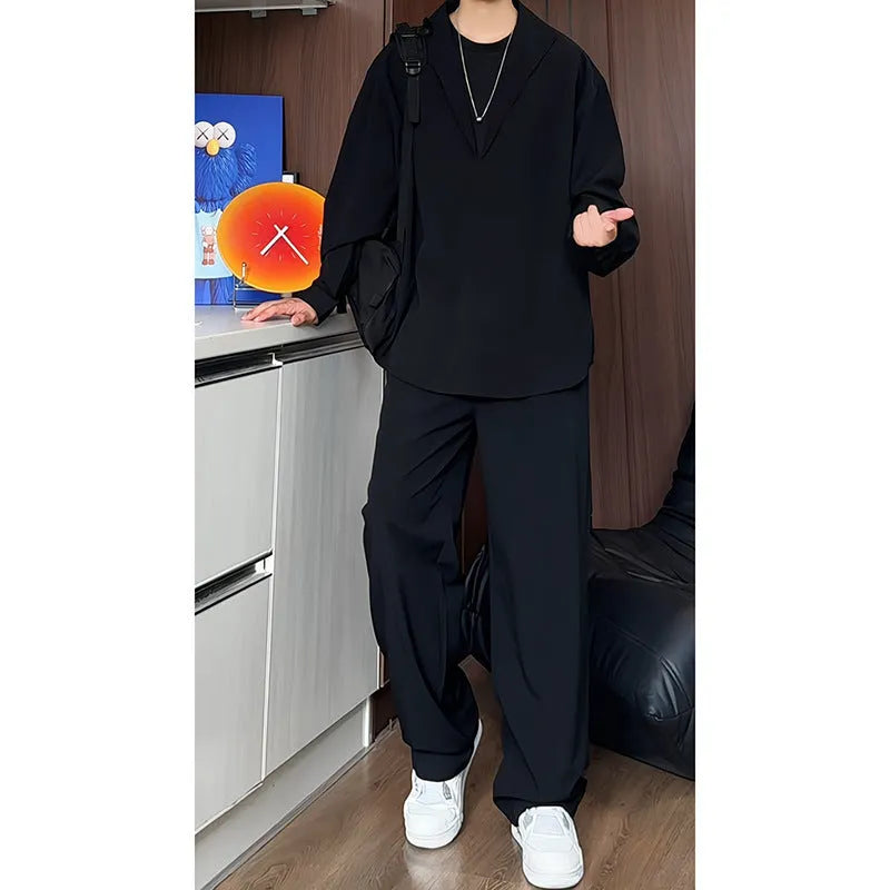 Men's black slim fit two-piece casual suit with long sleeve polo shirt and trousers on a hanger.