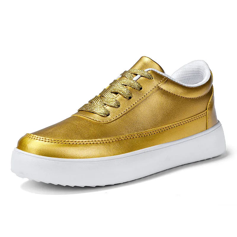 Women's white leather lace-up casual flat trainers on a plain background.