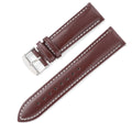 Quick release cowhide leather watch strap in black and white line colour on a watch.