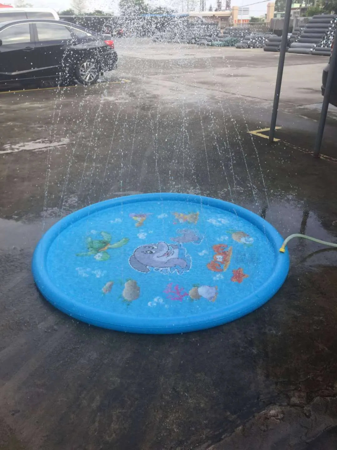 Blue PVC children's water spray play mat with marine animal designs for garden sprinkler play