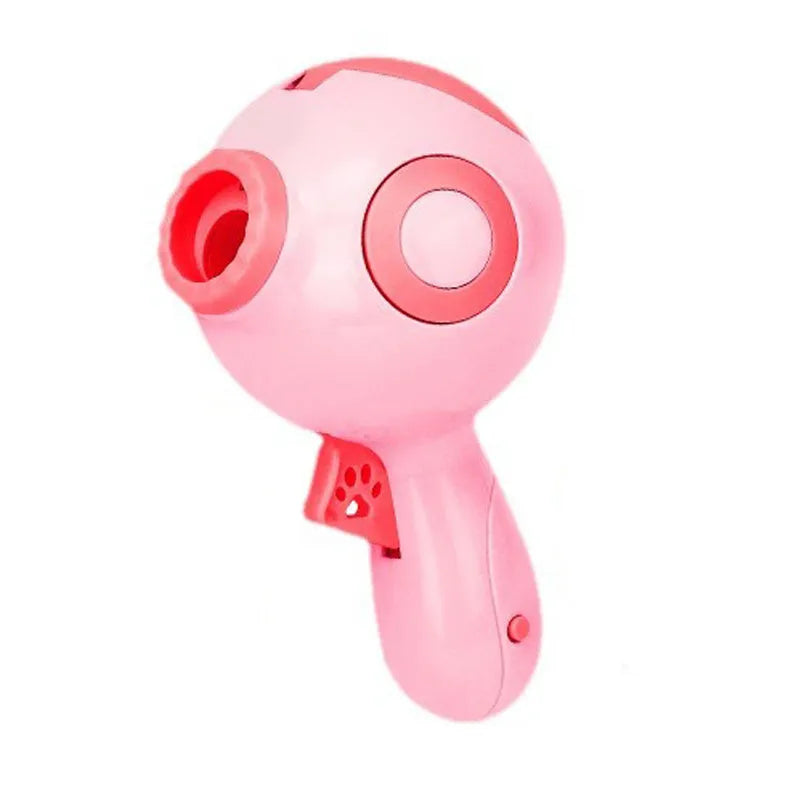 Green, orange, and pink ABS plastic dog treat launcher toy on a white background.