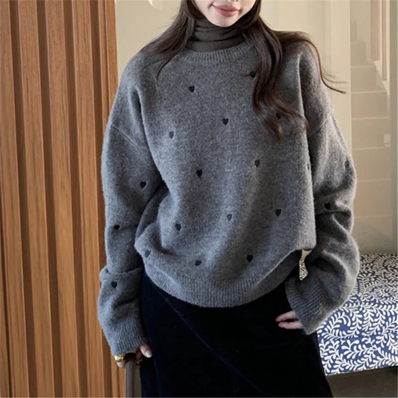Women's loose fit cream pullover sweater with love heart embroidery detail on the front