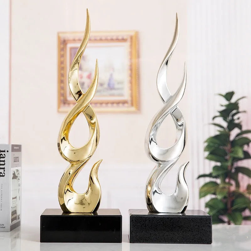 Festival high-rise decoration ornament in resin and plastic showing bright gold finish and modern simplicity style