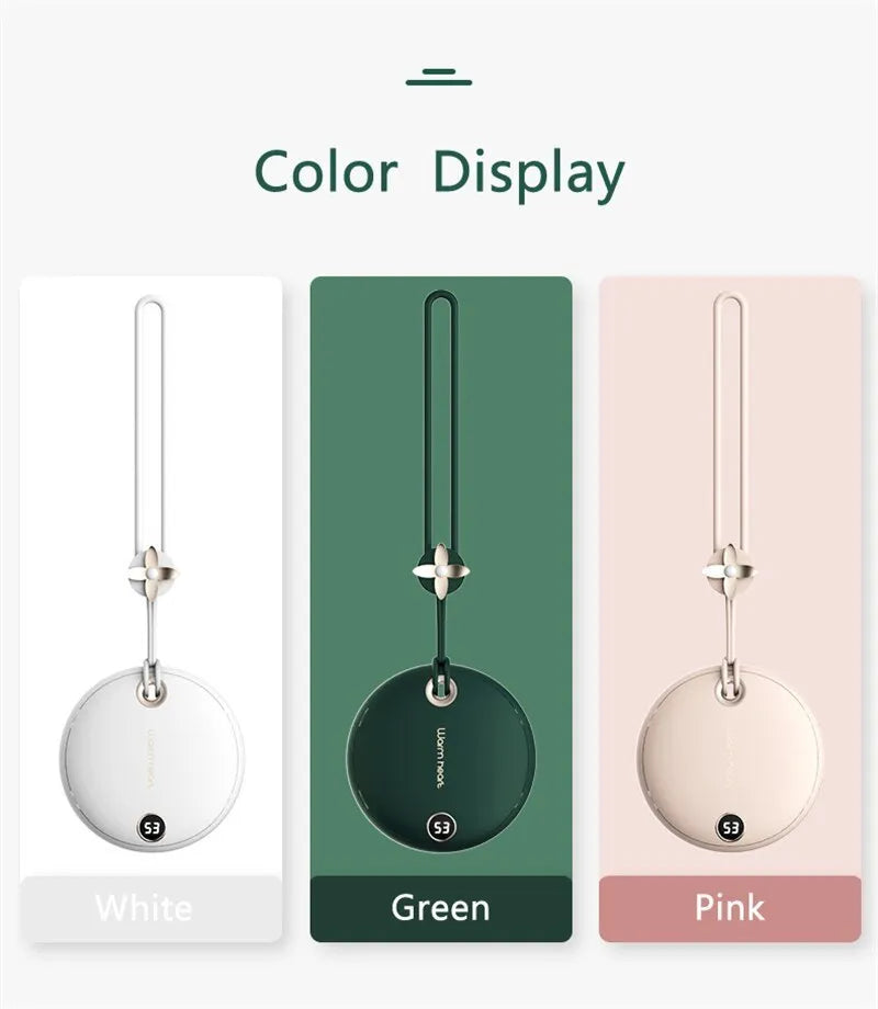 Green hand warmer power bank with digital display showing battery percentage, next to charging cable