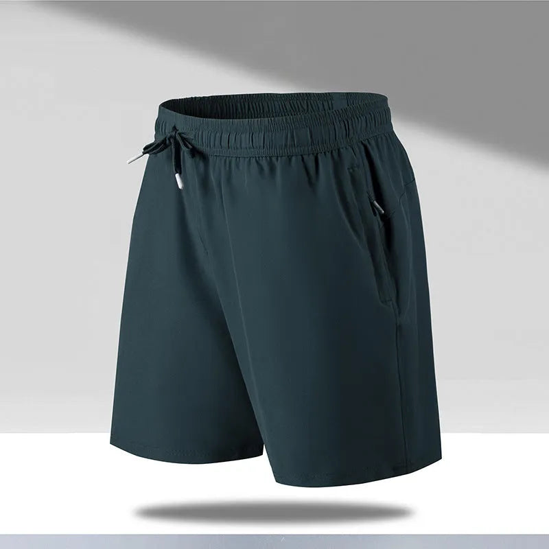 Man wearing loose black quick-dry sports shorts with an elastic waistband
