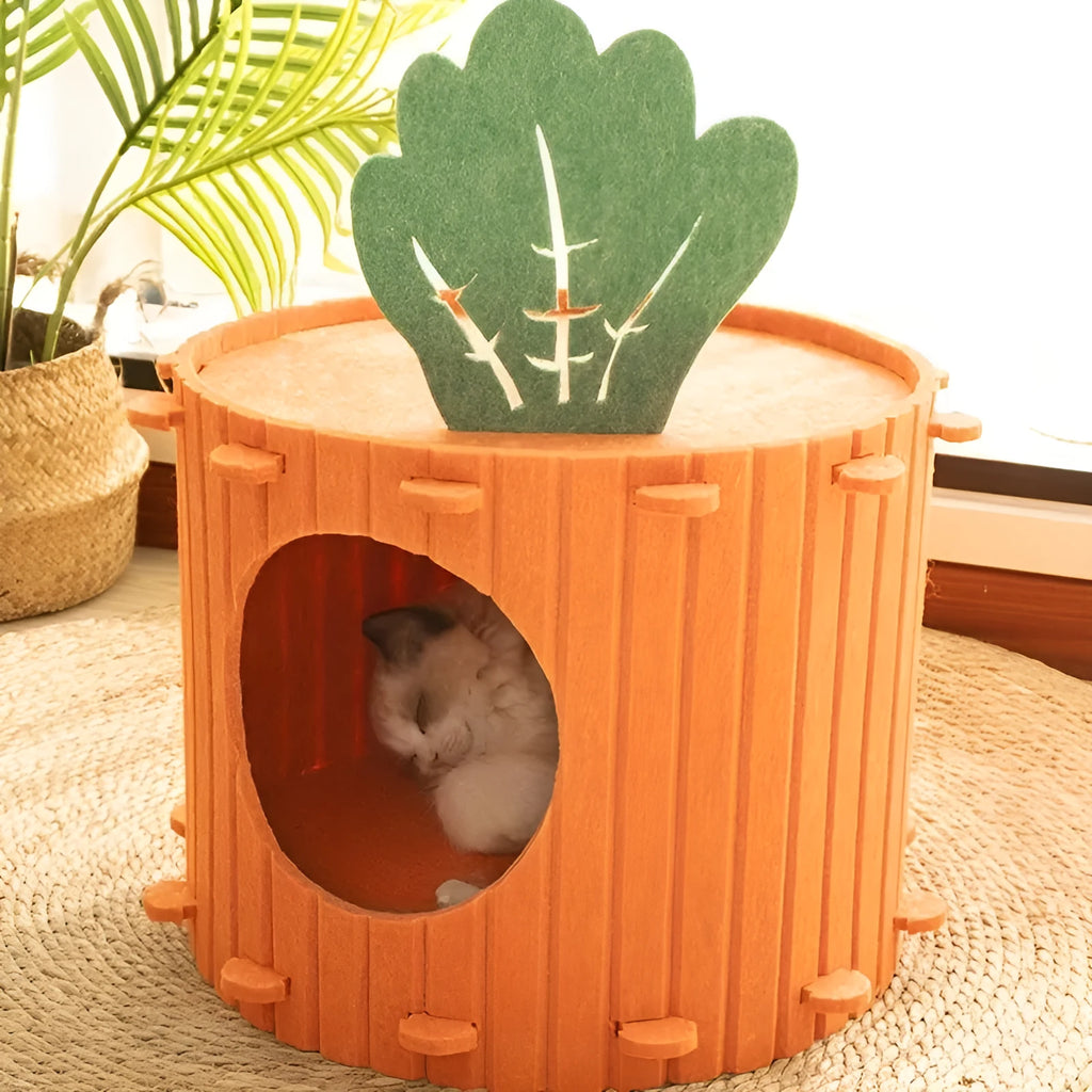 Orange carrot-shaped cat tunnel bed made of felt, showing its semi-enclosed design and entrance.