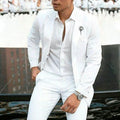 White men's two-piece slim fit wedding suit with jacket and trousers on hanger