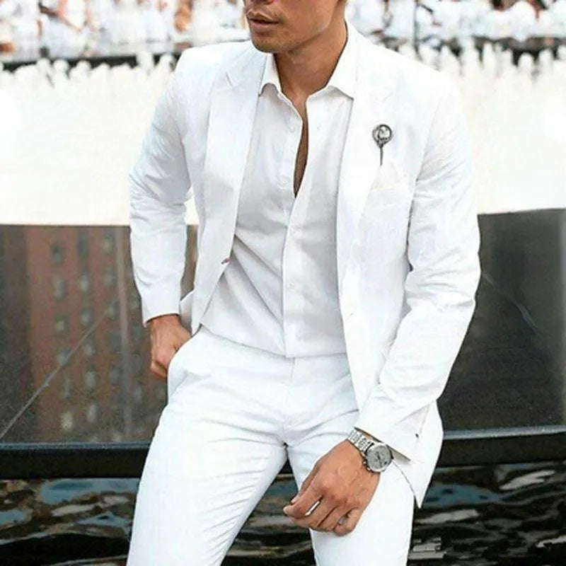 White men's two-piece slim fit wedding suit with jacket and trousers on hanger