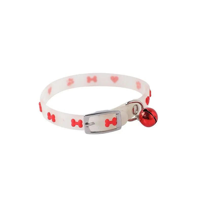 Glow in the dark cat collar with adjustable silicone chain and metal bell in paw print design