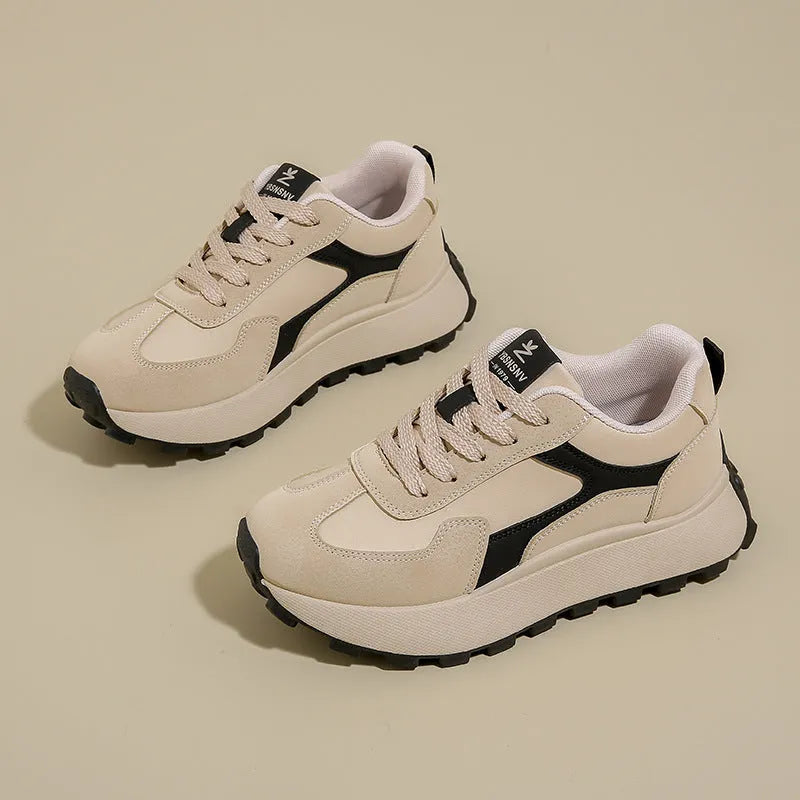 Women's low-top sports running shoes with mesh lining and front lace-up closure in solid colour options