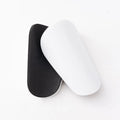Pair of black PU mini shin guards for sports protection, showing S size.