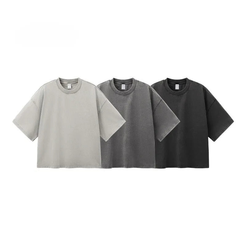 Men's loose vintage washed-out cotton t-shirt in khaki light colour, showing drop-shoulder sleeves and casual fit